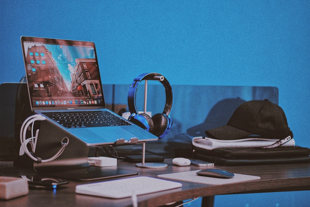 Podcast editing desk with laptop, microphone and headphones